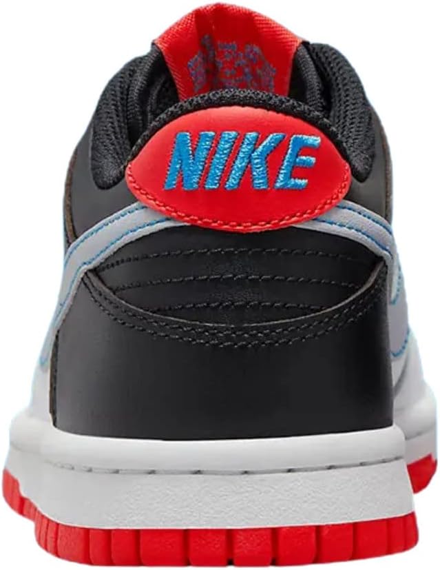 Big kid Nike Dunk Low heel view, black and white panels with red NIKE logo
