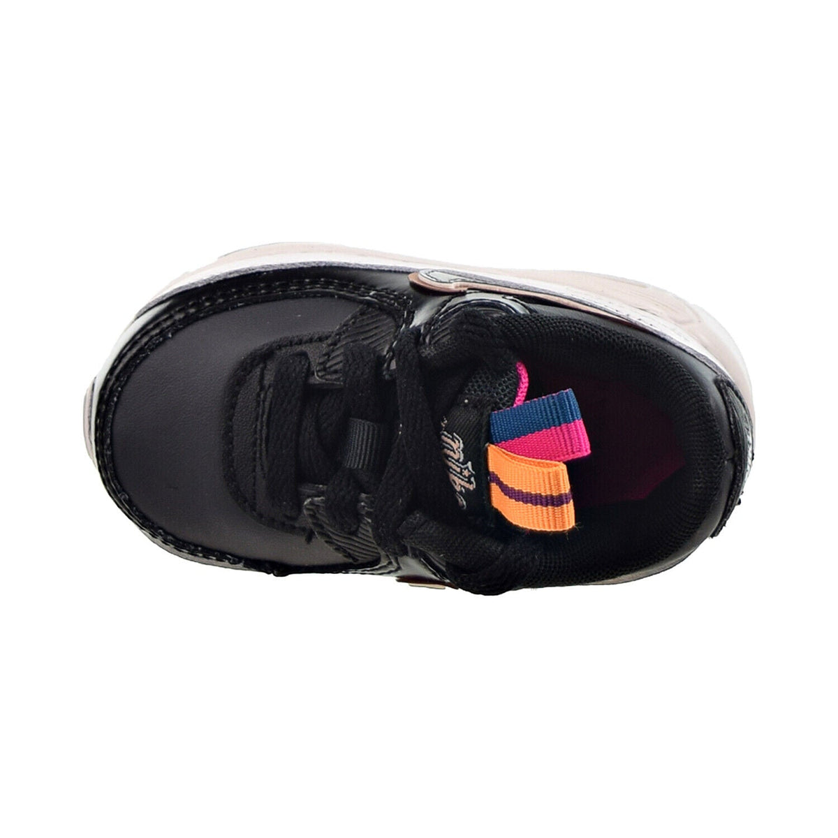 Toddler sneaker top view with black laces and multicolor strap detail at tongue