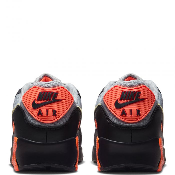 Men's Nike Air Max 90 sneakers heel view with orange NIKE AIR branding