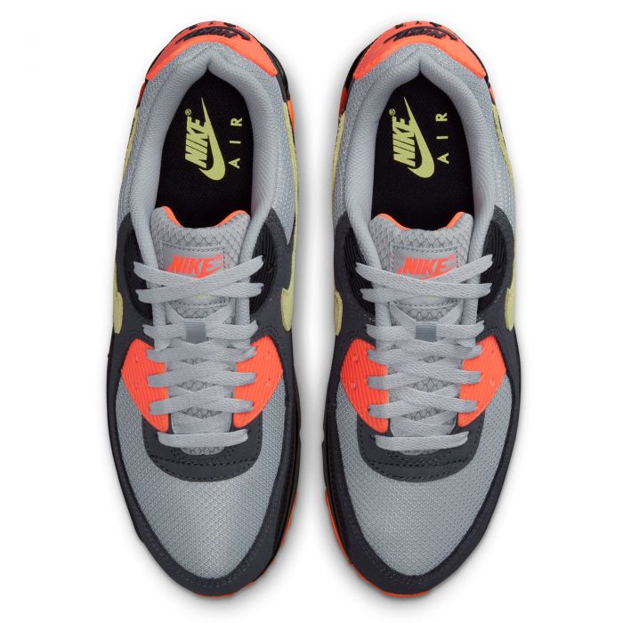 Men's Nike Air Max 90 sneakers top view with grey laces and orange tongue accents
