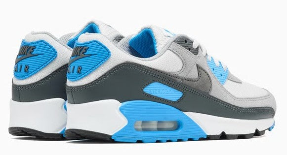 Men's Nike Air Max 90 sneakers with light gray upper, blue heel tabs, dark green side panels