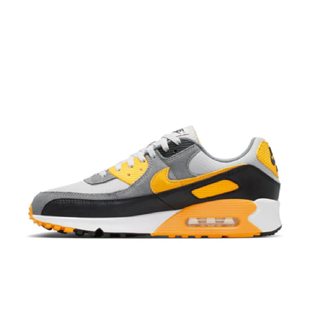 Nike Air Max 90 men's running shoe, side view with yellow swoosh and air unit