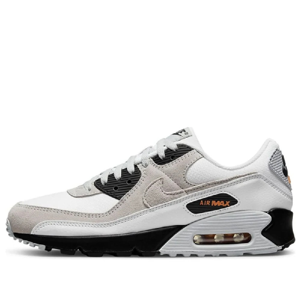 White running sneakers with beige panels, black eyestays, and air-cushioned sole