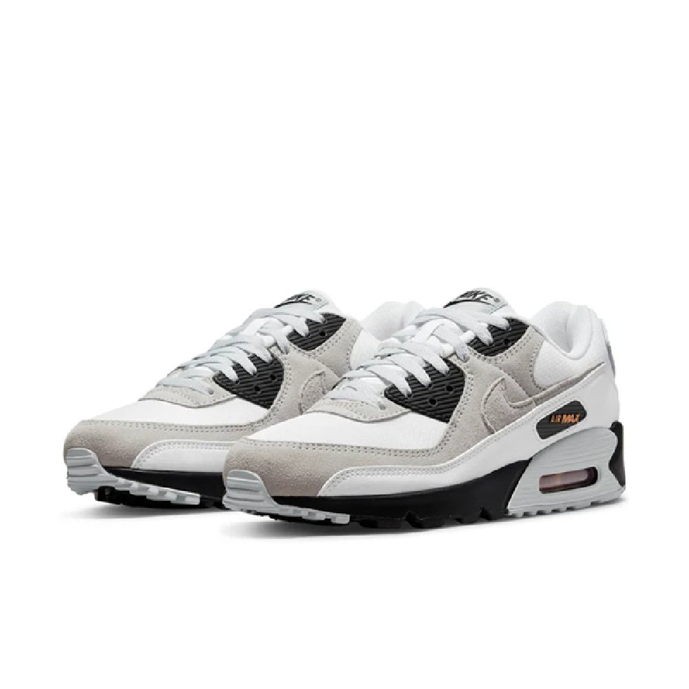 Pair of white running sneakers with beige toe panels, black sides, and air sole