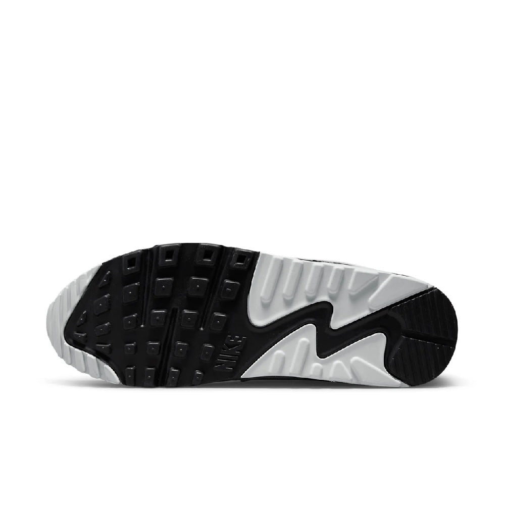 Black-and-white rubber outsole with tread pattern for grip under running sneakers