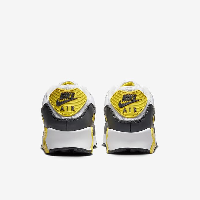 Men's Nike Air Max 90 sneakers, heel shows yellow 'AIR' logo and black heel tab