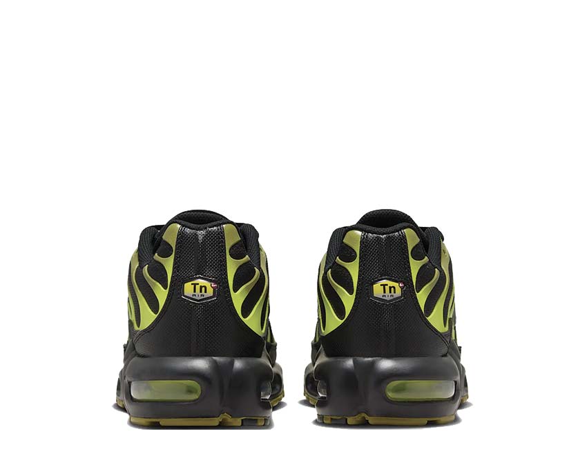 Air Max Plus sneakers with black heels and neon green accents, rear view pair