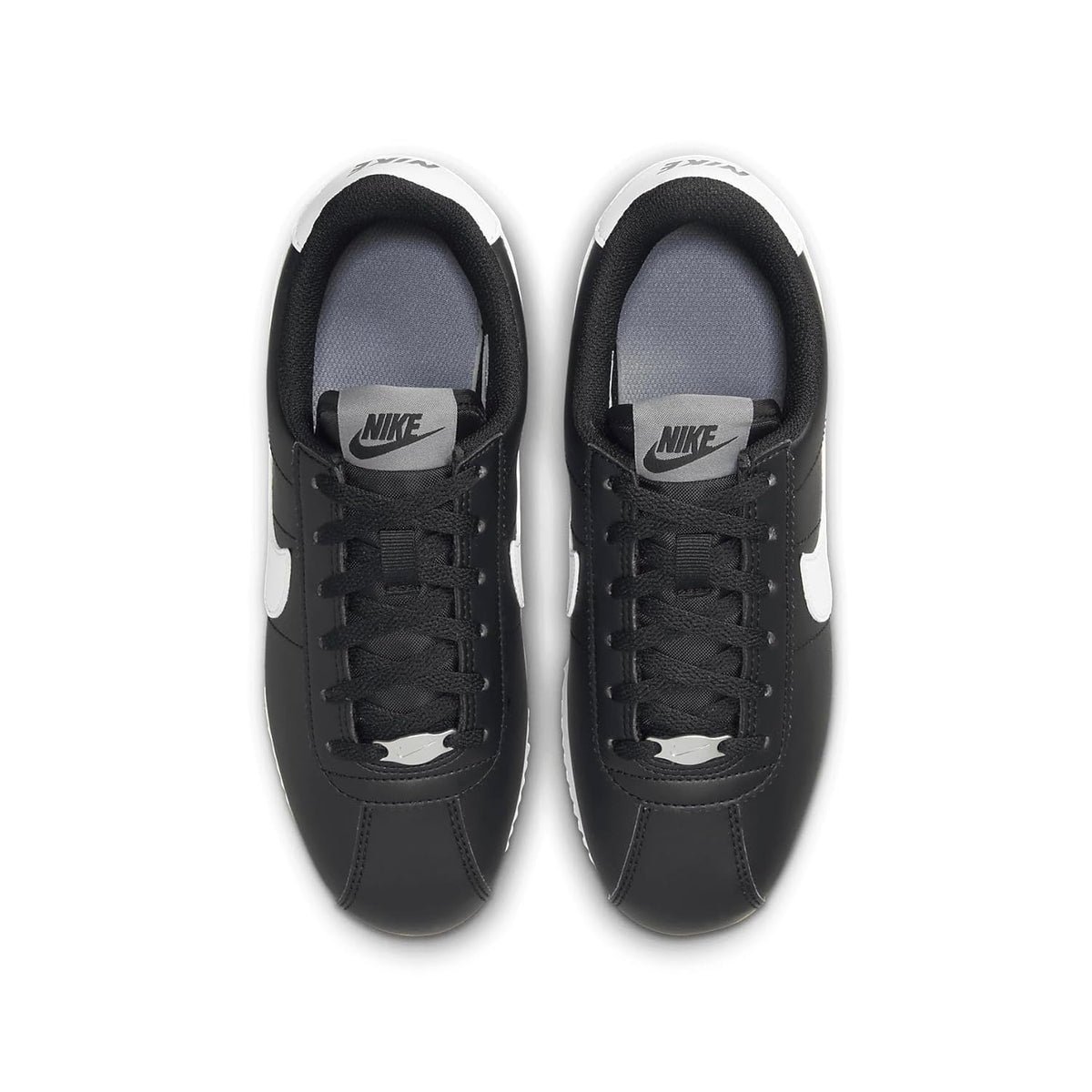 Kids' Nike Cortez sneakers, black uppers with white heel trim and Nike tongue label