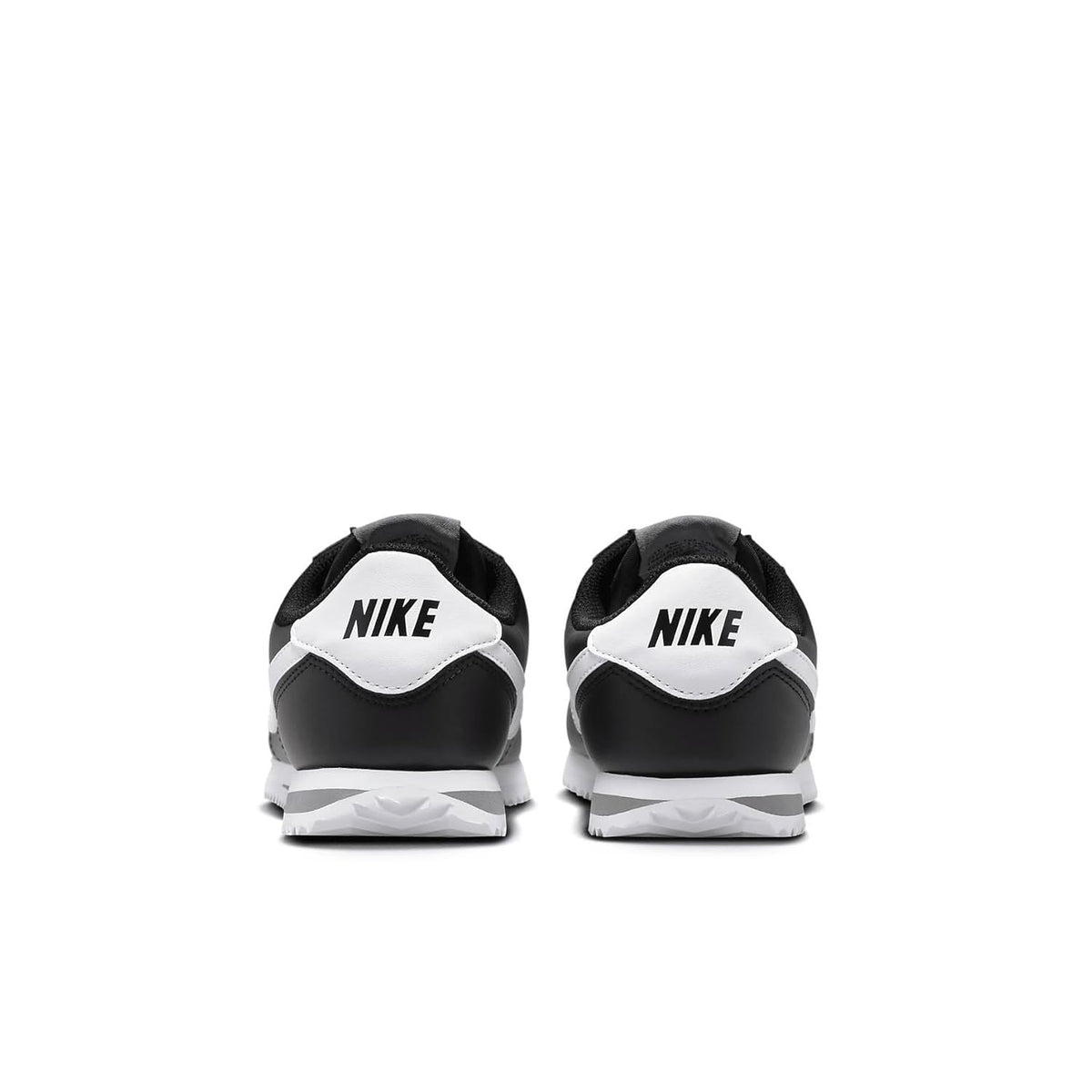 Kids' Nike Cortez heel sneakers in black with white Nike logo and stripe