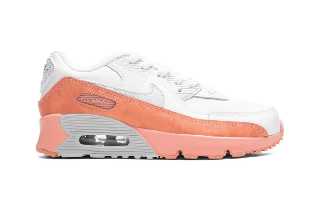 Kids' Nike Air Max 90 sneaker, white with orange overlays and visible Air unit sole