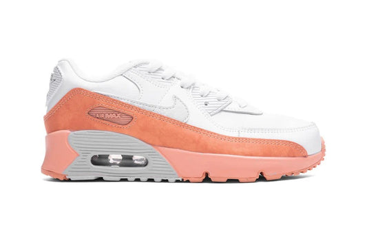 Kids' Nike Air Max 90 sneaker, white with orange overlays and visible Air unit sole