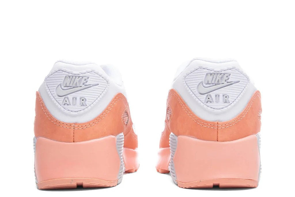 Kids' Nike Air Max 90 sneaker back view, white heel with Air Max logo and orange