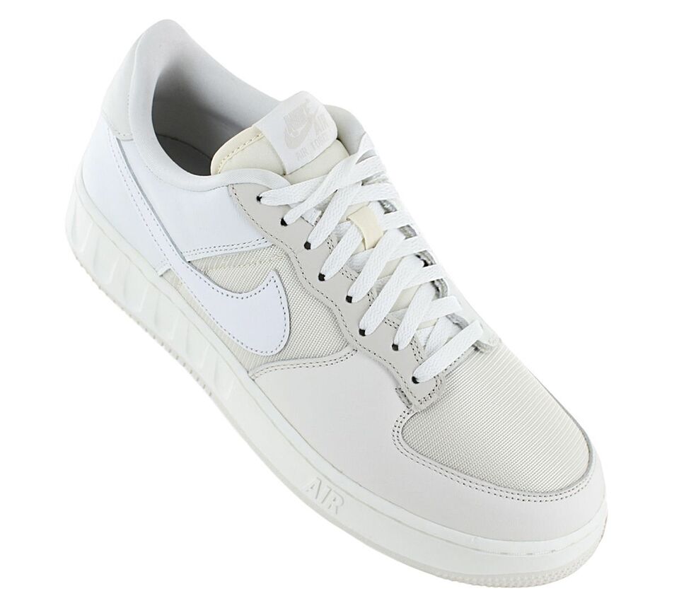 Nike Air Force 1 Low sneakers side view, white laces with light cream overlay panels