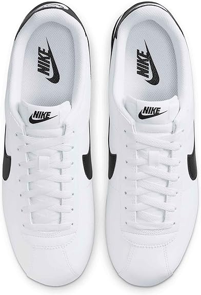 Pair of white low-top sneakers with Nike tongue logos and black heel tabs