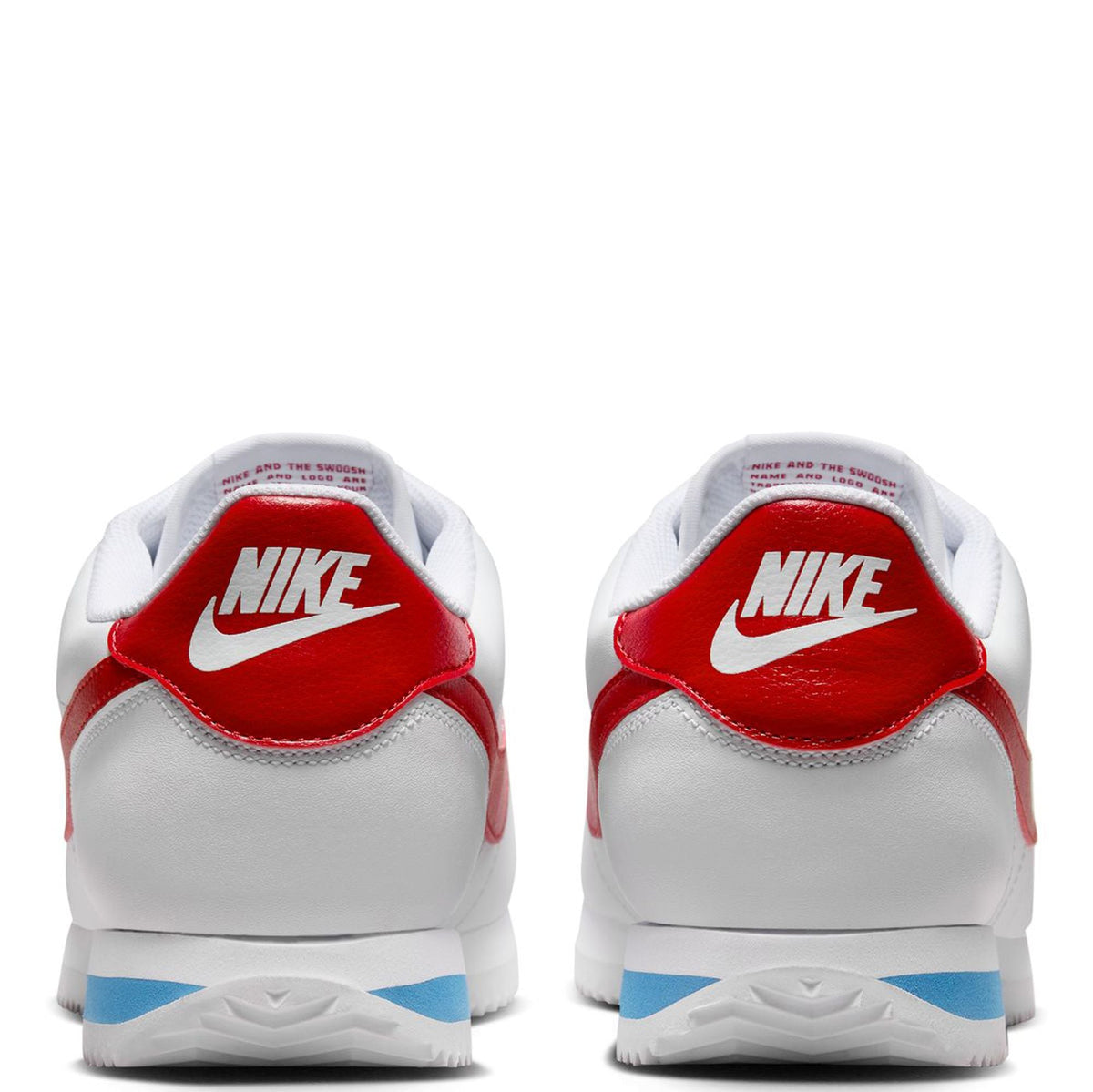 Nike Cortez sneakers with red heel tab and white backs, blue outsole stripe detail