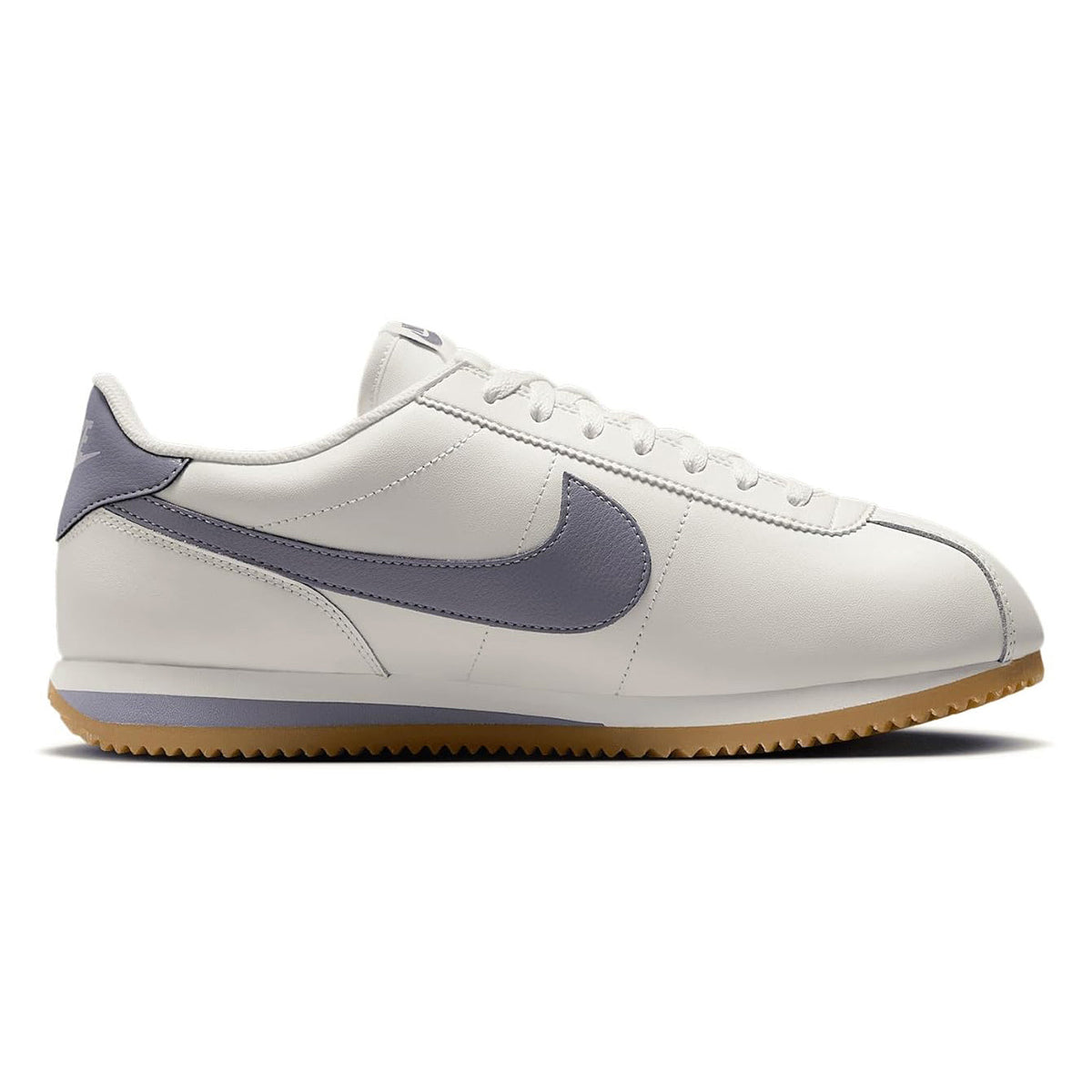 Men's Nike Cortez sneakers, white leather with navy swoosh overlay and gum sole.