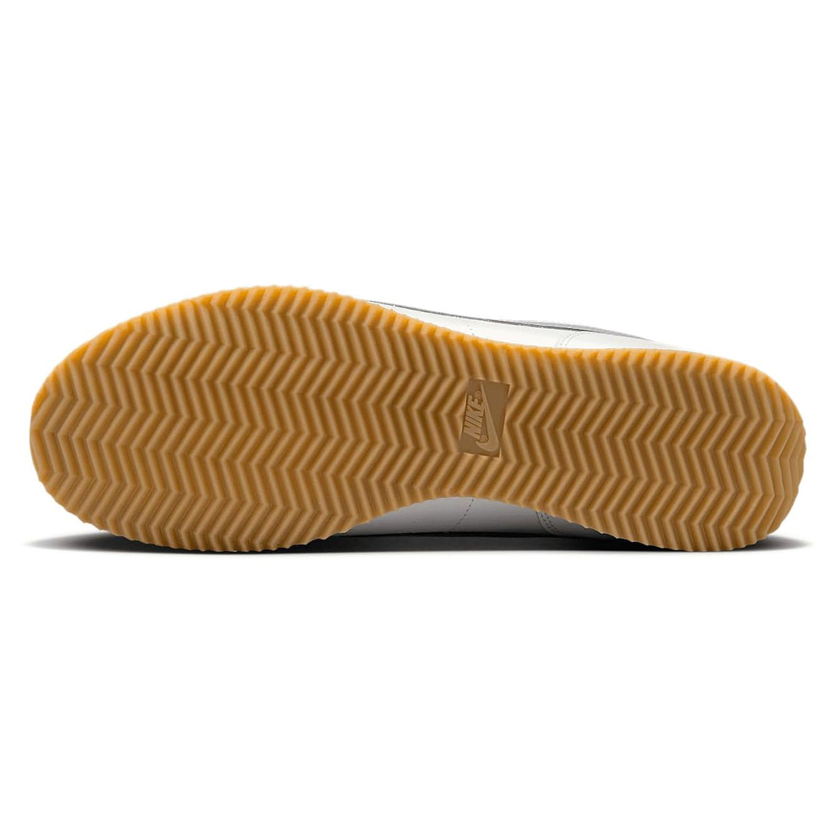 Gum rubber outsole for Nike Cortez sneakers with zigzag tread pattern.