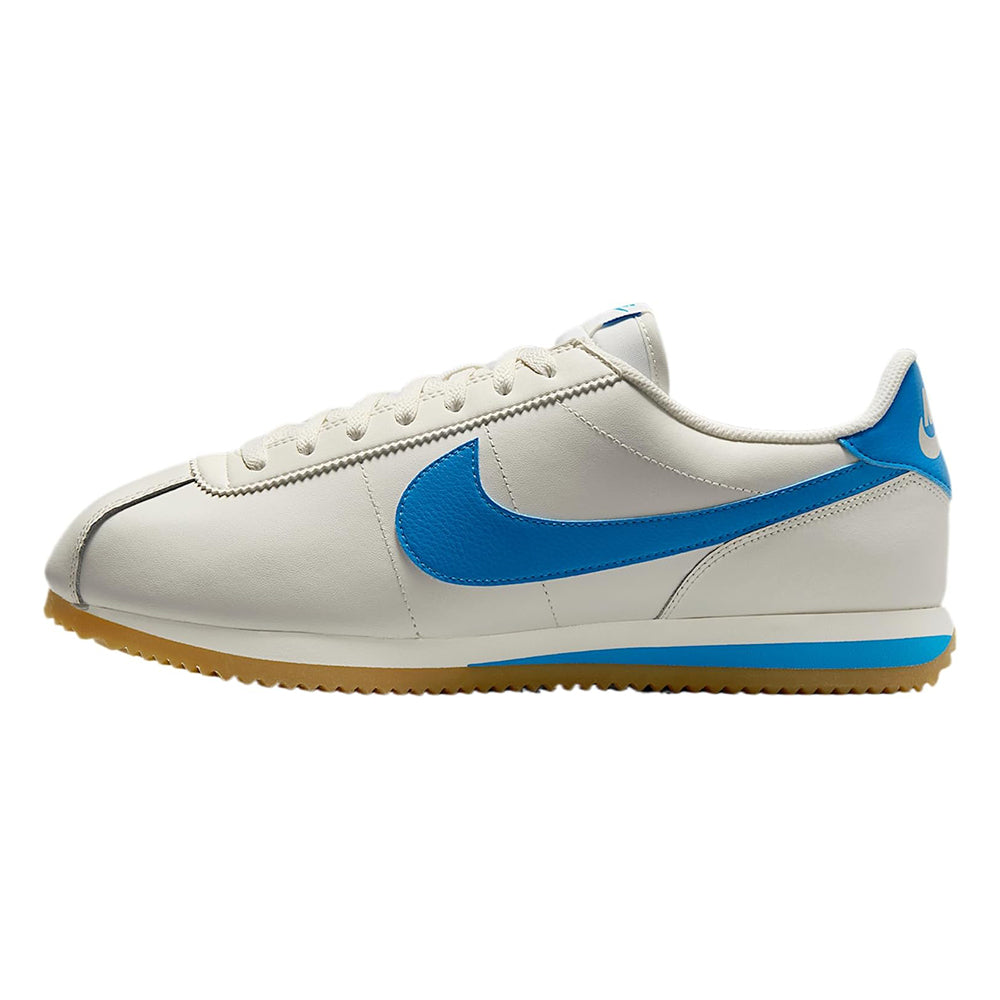 Nike low-top sneakers, white upper with blue swoosh and gum yellow outsole