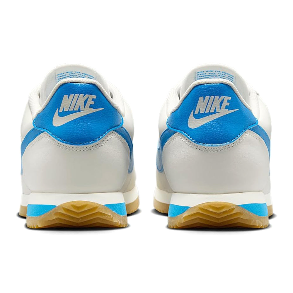Nike low-top sneakers, white heel with blue paneling and Nike branding