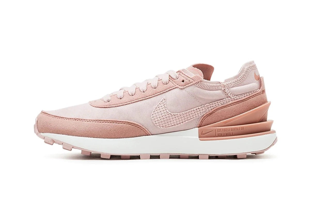 Women's Nike Waffle One ESS sneakers, light pink upper with laces and visible swoosh