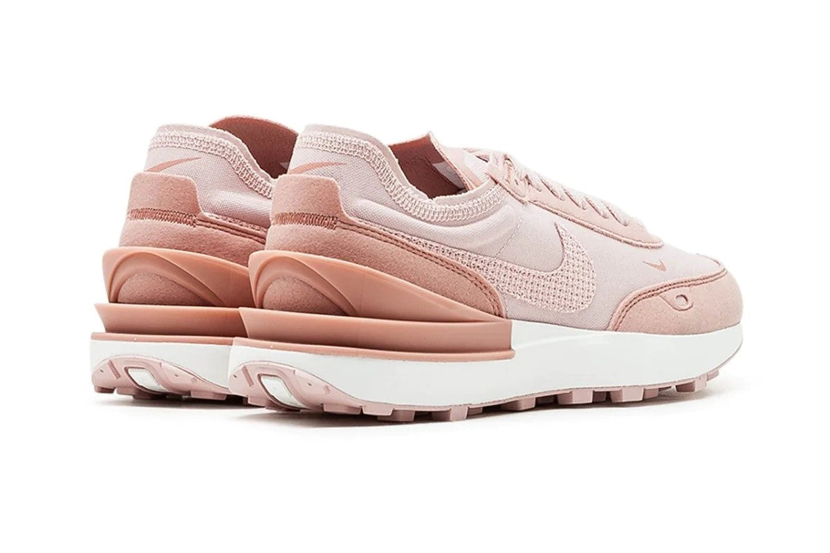 Women's Nike Waffle One ESS sneakers, heel view with light pink panels and ridged outsole