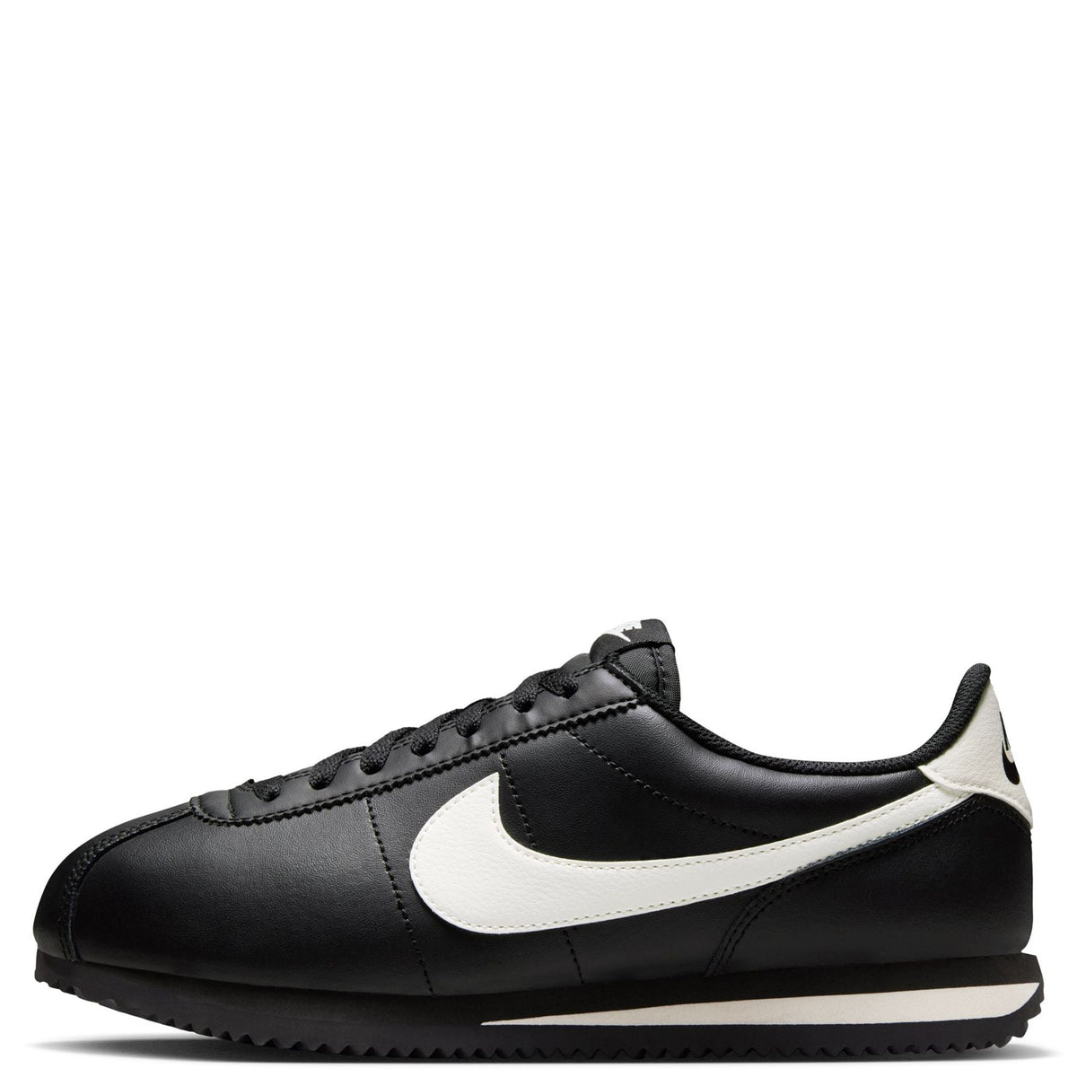 Nike Cortez low-top sneakers in black with pale ivory swoosh, lace-up
