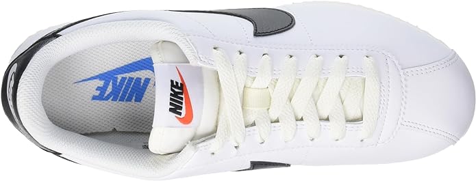 Women's Nike Cortez sneaker interior: white lining, laces, and Nike tongue label