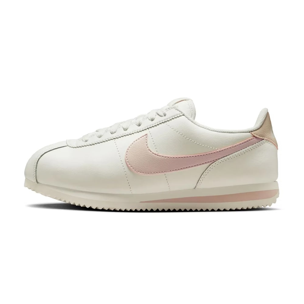 Nike Cortez low-top sneakers, side view: white upper with pink Swoosh detail