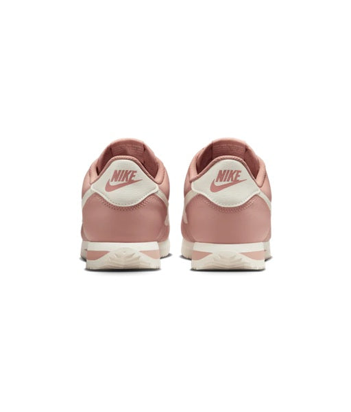 Women's Nike Cortez pair with pink uppers, Nike heel logo, and Sail midsole