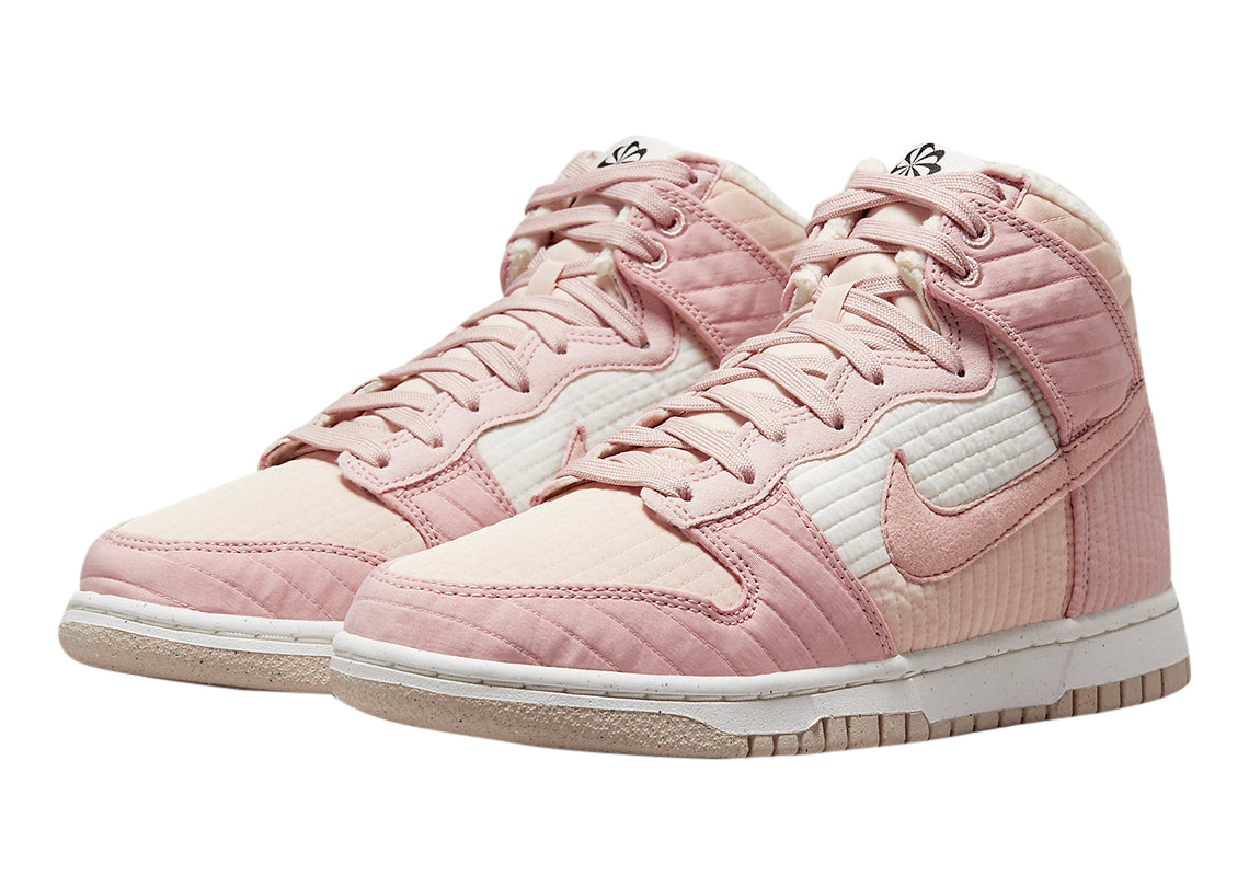 Pair of women's pink high-top sneakers with stitched panels and lace-up design