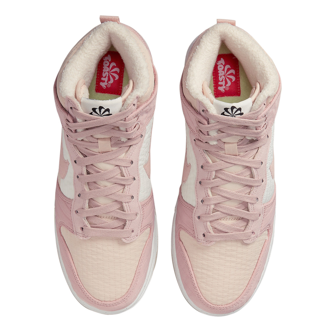 Women's pink high-top sneakers with plush white lining at the collar and lace-up front