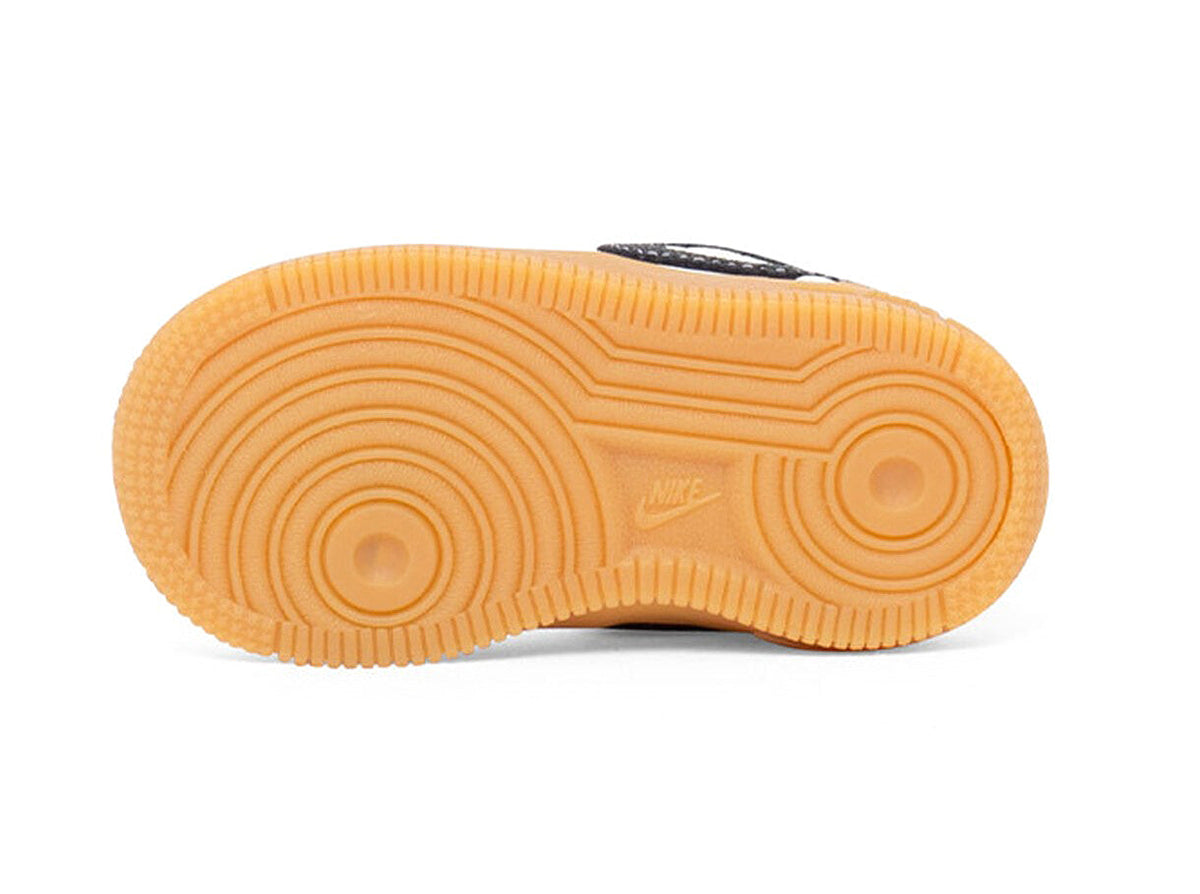 Gum rubber outsole with circular tread and Nike logo for low-top sneakers
