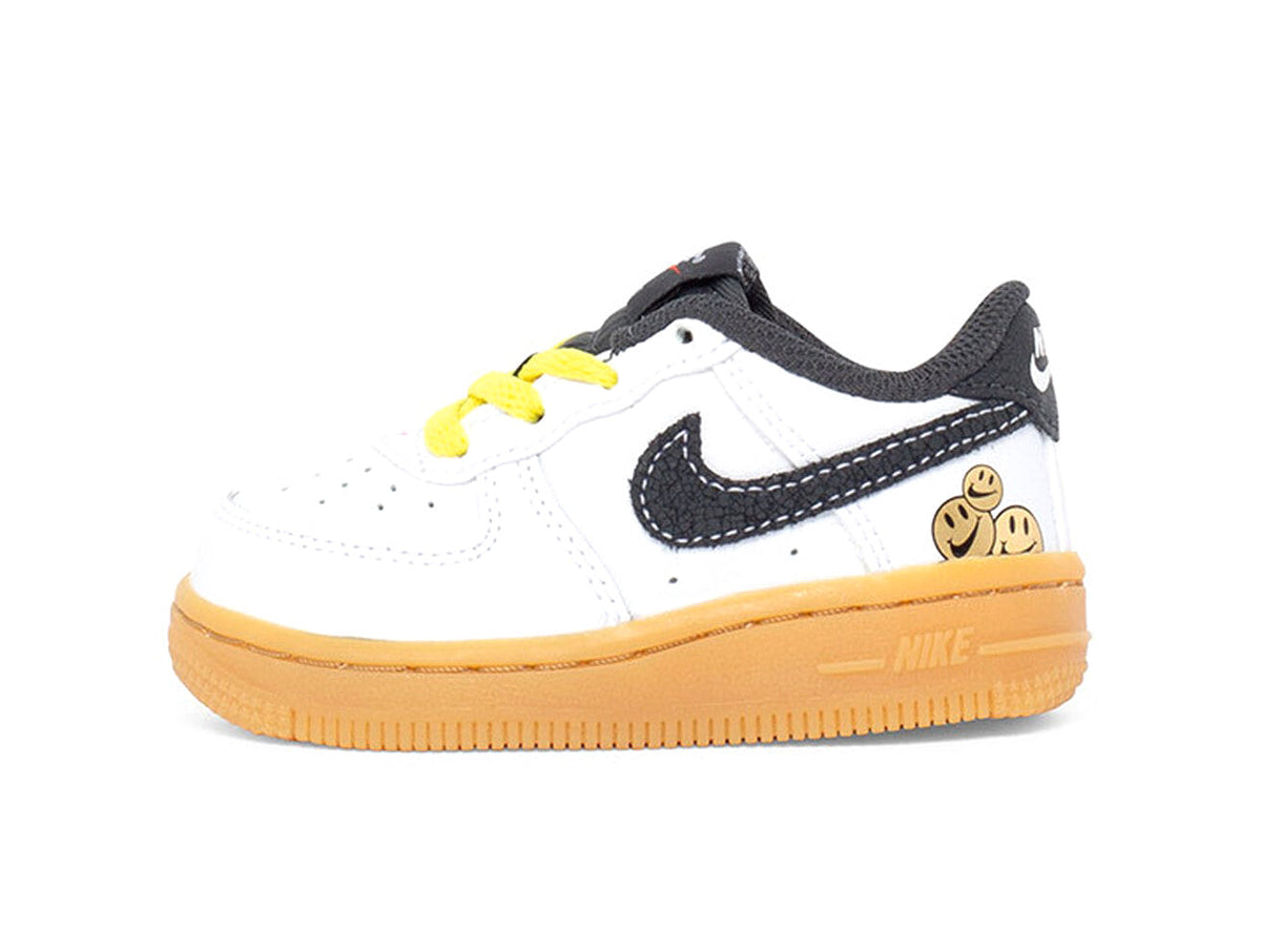 Toddler's Nike Force 1 LV8 low-top sneakers, white with black swoosh, yellow laces, gum sole