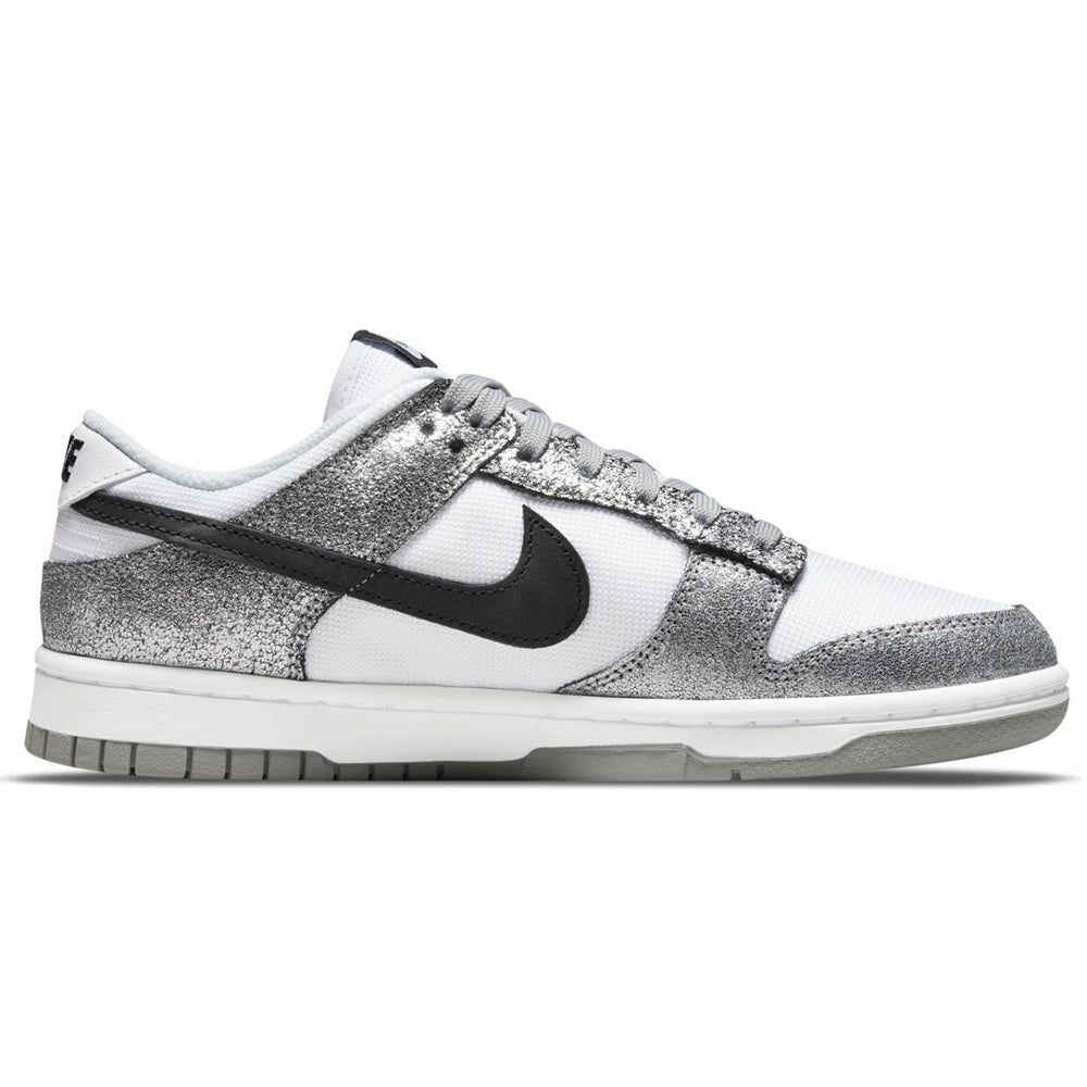 Women’s Nike Dunk Low sneakers in metallic silver, off-white, and black