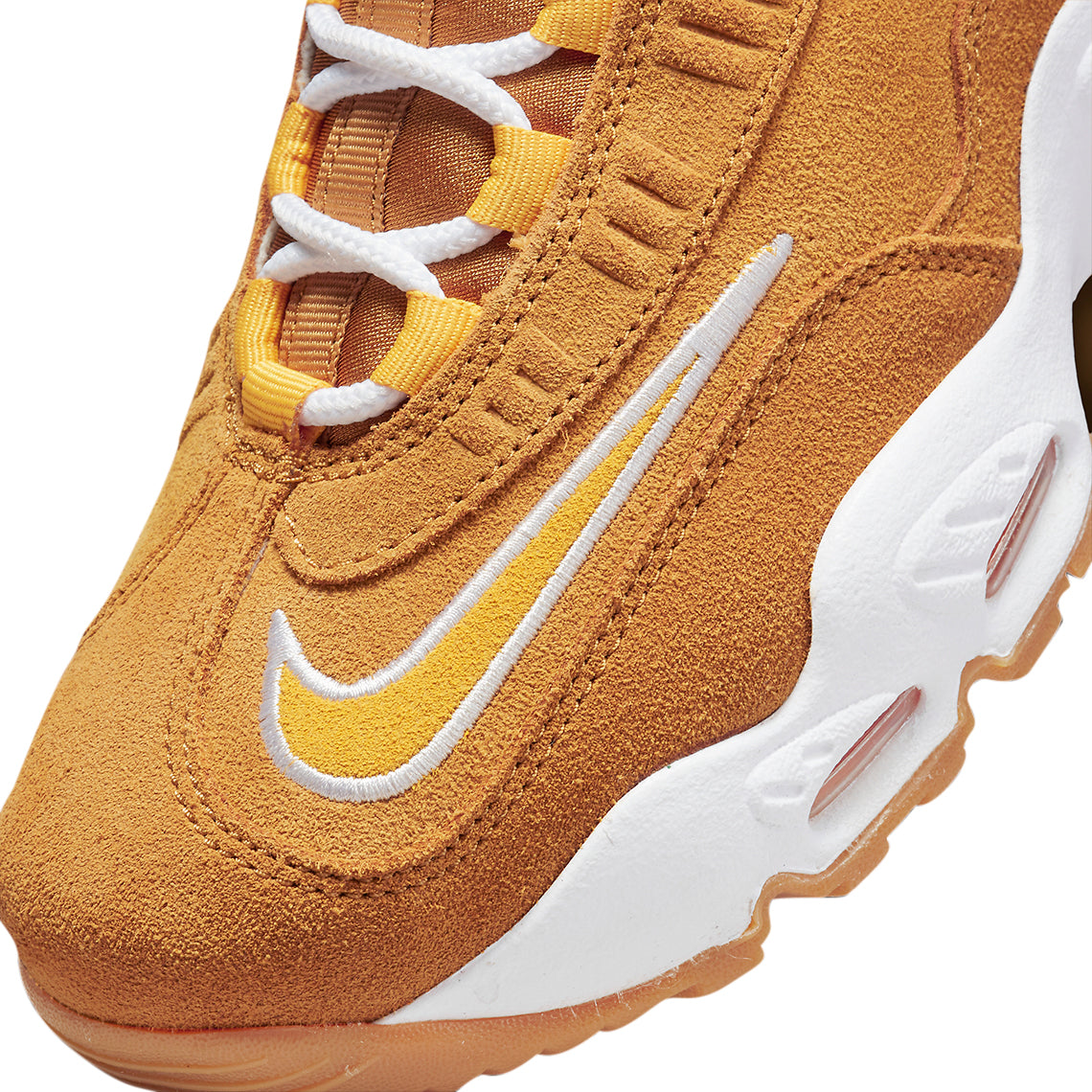 Kids high-top sneakers close-up: wheat suede, white swoosh, laces, and air pod