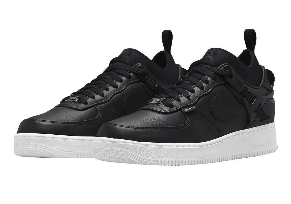 Men's Nike Air Force 1 Low SP sneakers, pair view in black with white rubber soles