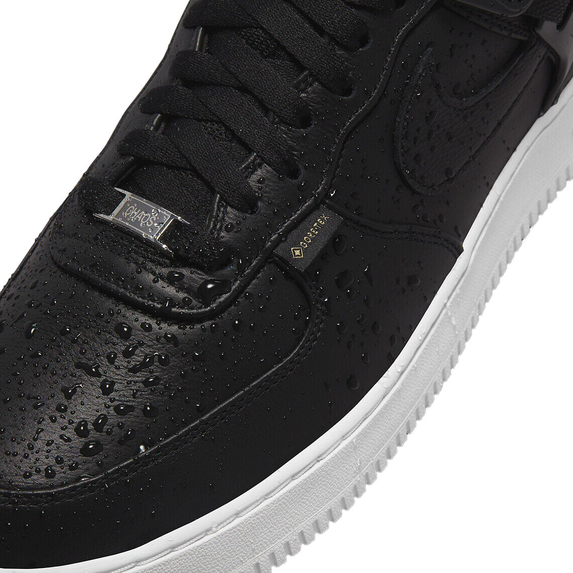 Men's Nike Air Force 1 Low SP sneakers, close-up of black leather with textured details