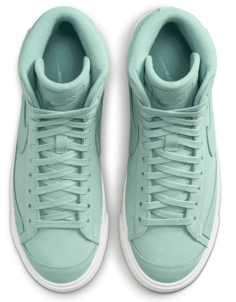 Mint Nike lace-up sneakers with padded tongue and visible interior lining