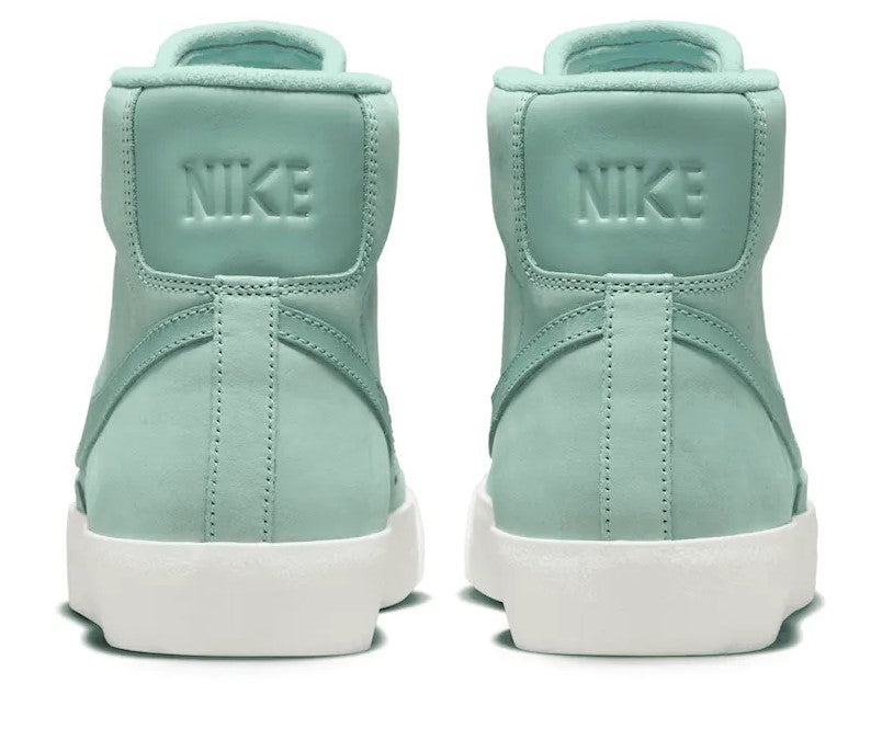 Mint Nike high-top sneakers, back view with NIKE logo and white sole