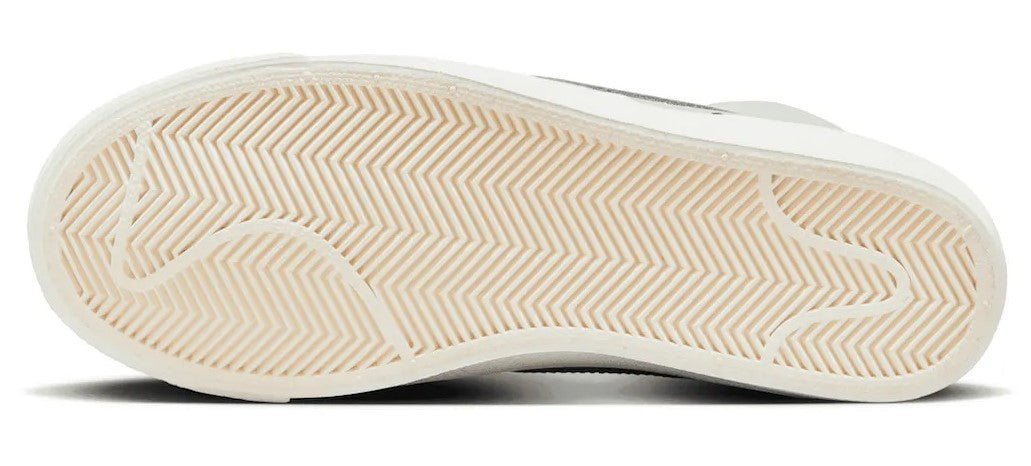 White rubber outsole with herringbone tread pattern for Nike high-top sneaker