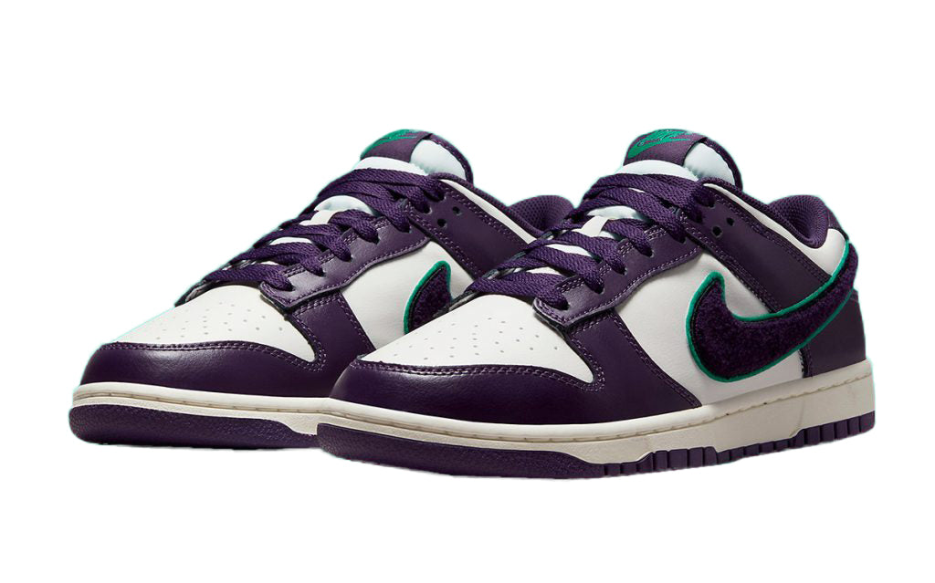 Nike Dunk Low sneakers, purple laces and white toe panels with green swoosh