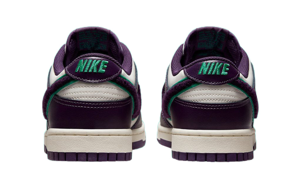 Nike Dunk Low sneakers, rear view with green Nike logo on purple collar