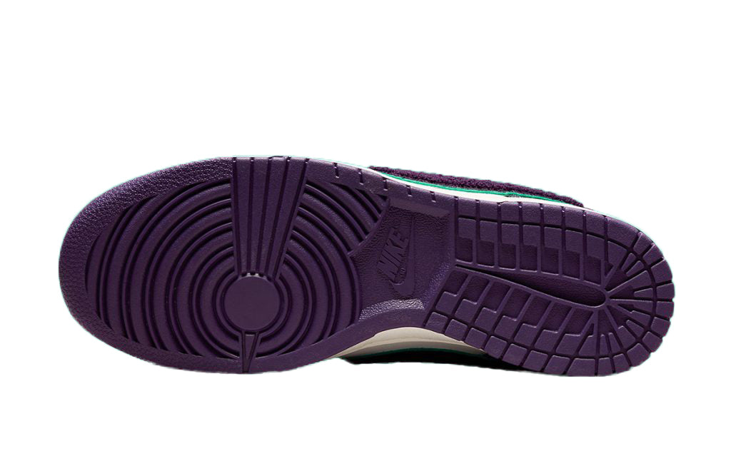 Nike Dunk Low outsole, purple rubber tread with textured circular pattern