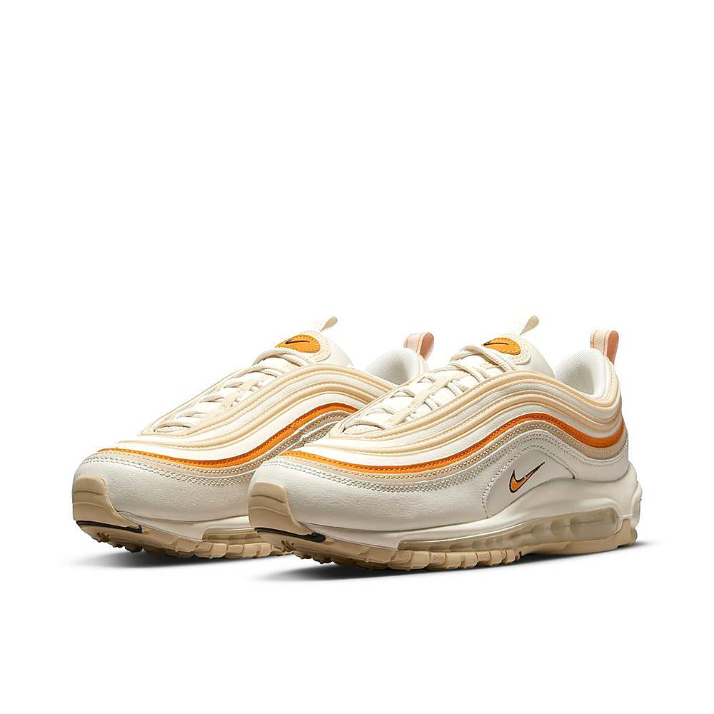 Women's Nike Air Max 97 sneaker pair, cream upper with orange wave trim and gum sole