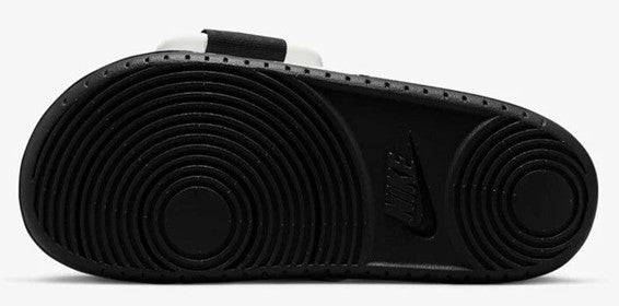 Men's Nike Offcourt slide sandal outsole, textured black tread with circular patterns