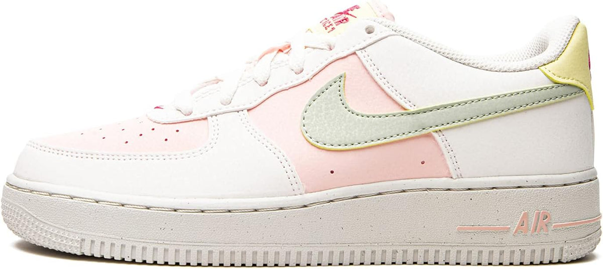 Big kid white leather sneakers with pink panels and mint swoosh, lace-up front.