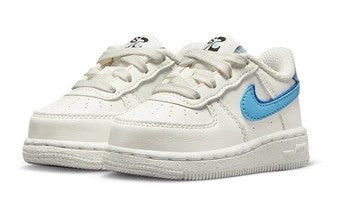 Toddler low-top sneakers, white uppers with blue Nike Swoosh and padded heel