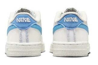 Toddler low-top sneakers, white with light blue heel lining and Nike logo tabs