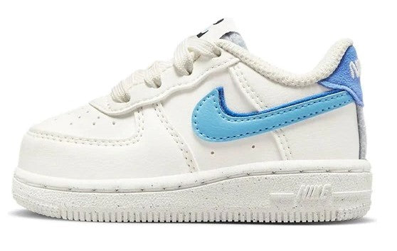 Toddler low-top sneakers, white leather with blue Nike Swoosh and lace-up front