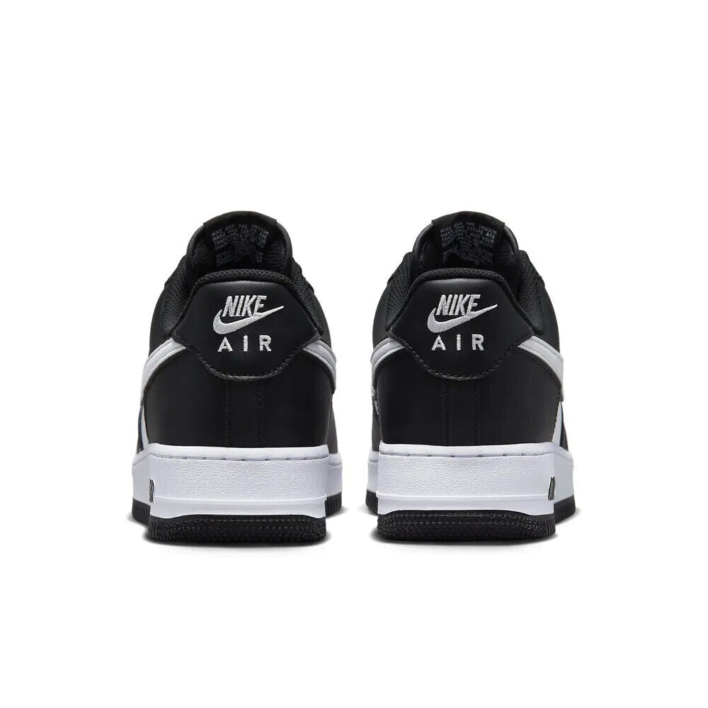 Nike Air Force 1 '07 sneakers black and white, rear view with Nike Air tabs